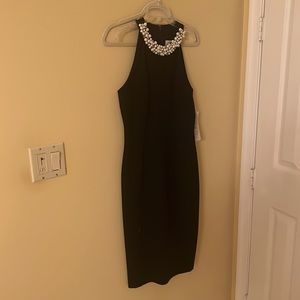 Beautiful black dress with pearl detailed neckline